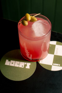 A cocktail on a Loco's Bar coaster